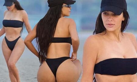 Kim Kardashian flashes two middle fingers in bikini pictures of hot tubs